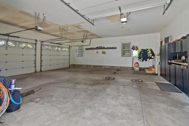 1201 Lance Dr, Twin Lakes, WI 53181 - garage featuring a garage door opener