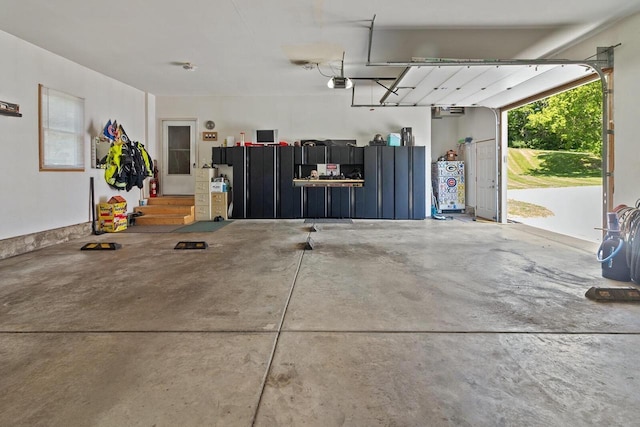 1201 Lance Dr, Twin Lakes, WI 53181 - garage with a garage door opener