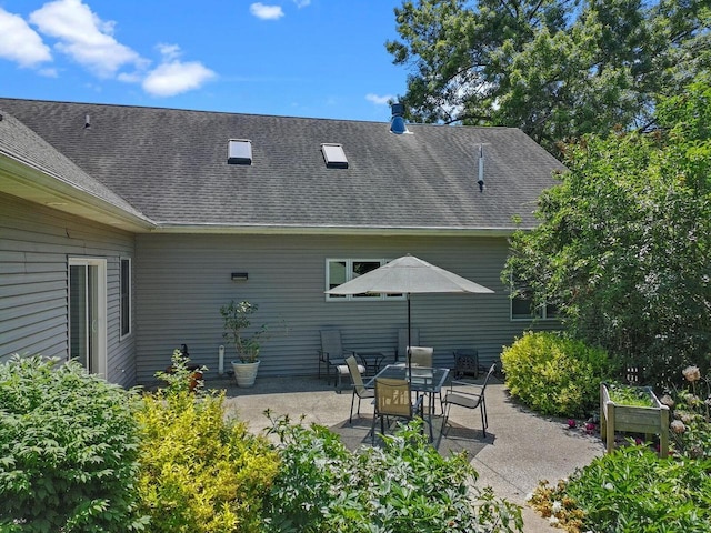 1201 Lance Dr, Twin Lakes, WI 53181 - rear view of house with a patio and roof with shingles