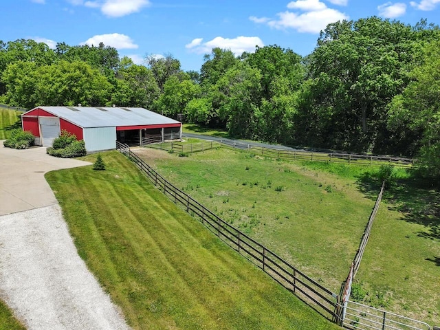 1201 Lance Dr, Twin Lakes, WI 53181 - view of yard with an outdoor structure, an exterior structure, a detached garage, concrete driveway, and a rural view