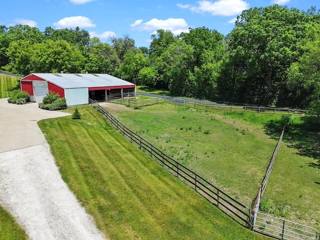 1201 Lance Dr, Twin Lakes, WI 53181 - view of yard featuring an exterior structure, an outbuilding, driveway, a garage, and a view of countryside