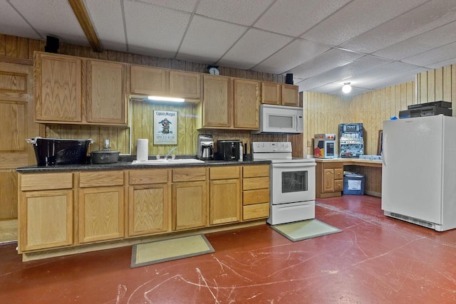 1201 Lance Dr, Twin Lakes, WI 53181 - kitchen featuring white appliances, a drop ceiling, dark countertops, and wood walls