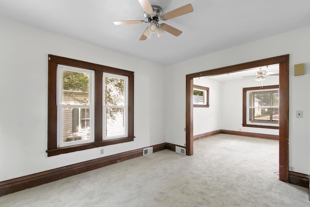 215 W Burns St, Portage, WI 53901 - carpeted empty room featuring healthy amount of natural light and ceiling fan