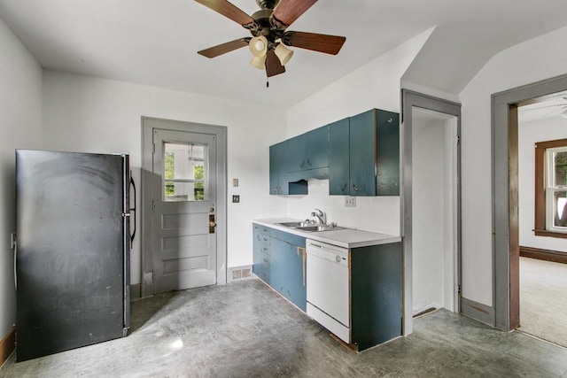215 W Burns St, Portage, WI 53901 - kitchen with white dishwasher, ceiling fan, freestanding refrigerator, light countertops, and decorative backsplash