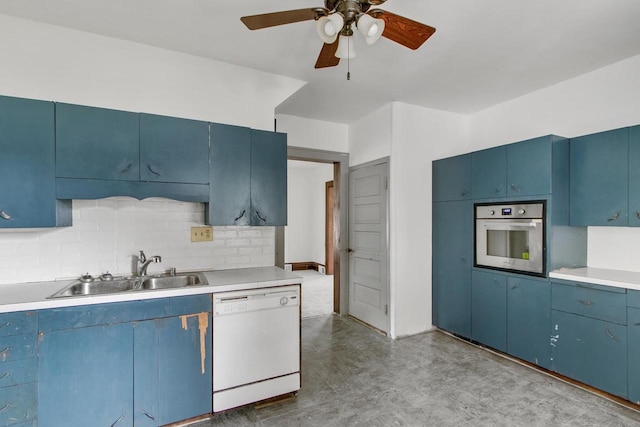 215 W Burns St, Portage, WI 53901 - kitchen with dishwasher, stainless steel oven, blue cabinets, a ceiling fan, and light countertops