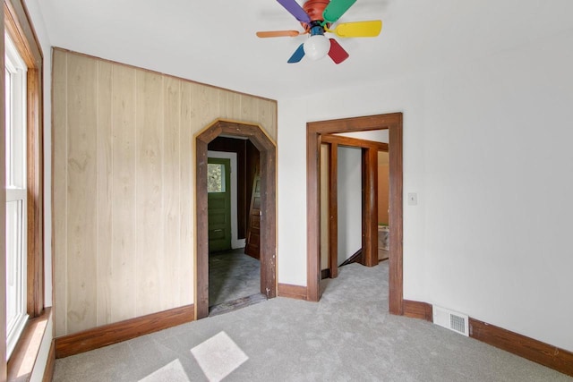 215 W Burns St, Portage, WI 53901 - unfurnished room with ceiling fan, carpet flooring, and arched walkways