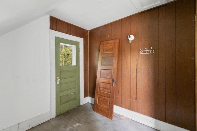 215 W Burns St, Portage, WI 53901 - entrance foyer with wood walls, wood finished floors, and lofted ceiling