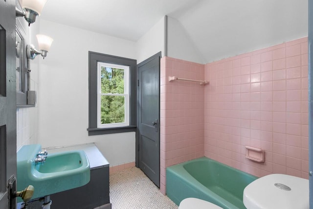 215 W Burns St, Portage, WI 53901 - bathroom featuring tile patterned flooring, vanity, and  shower combination