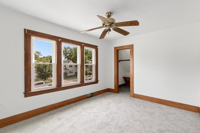 215 W Burns St, Portage, WI 53901 - empty room featuring light colored carpet and ceiling fan