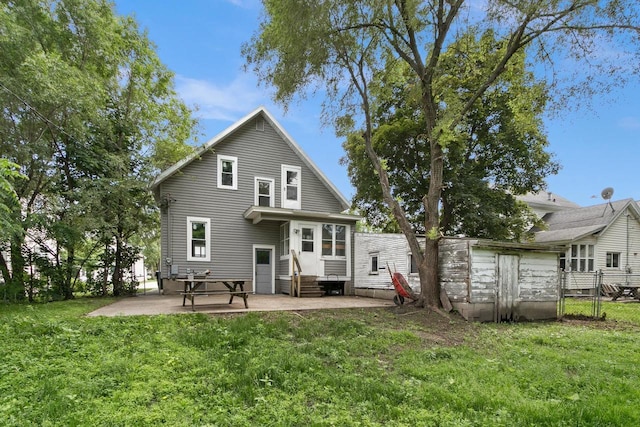 215 W Burns St, Portage, WI 53901 - rear view of house featuring entry steps and a patio area