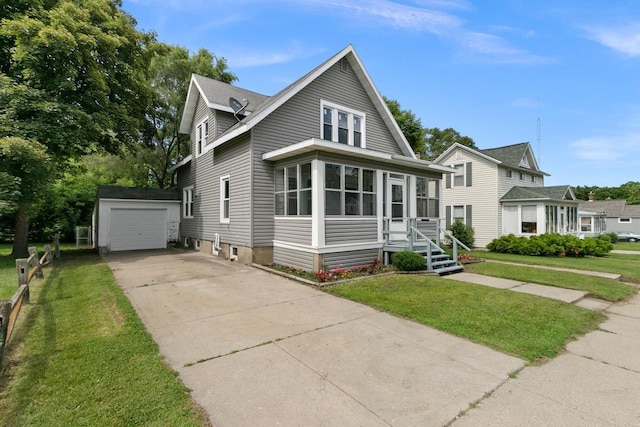 215 W Burns St, Portage, WI 53901 - view of front of property with an outbuilding, driveway, a front yard, and a garage