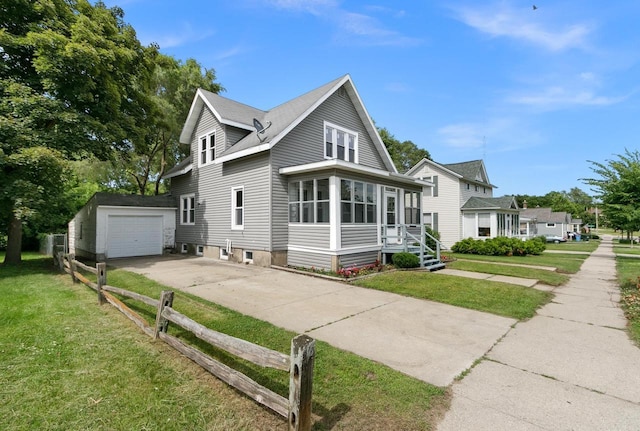 215 W Burns St, Portage, WI 53901 - view of home's exterior featuring driveway, an outbuilding, and a sunroom