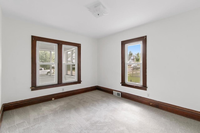 215 W Burns St, Portage, WI 53901 - unfurnished room with plenty of natural light and carpet floors