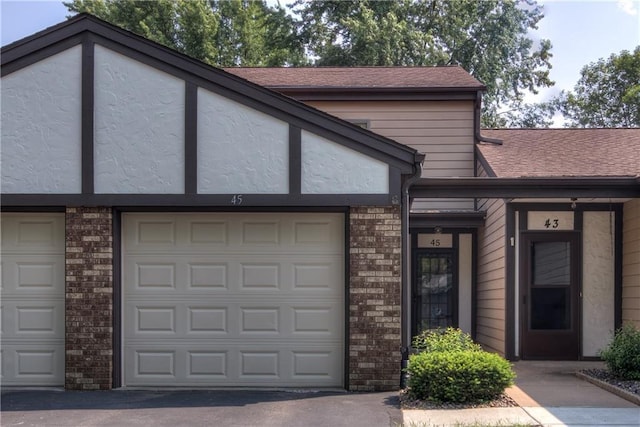45 Stump Lake Rd Unit 6, Chippewa Falls, WI 54729 - multi unit property with brick siding, roof with shingles, asphalt driveway, and a garage