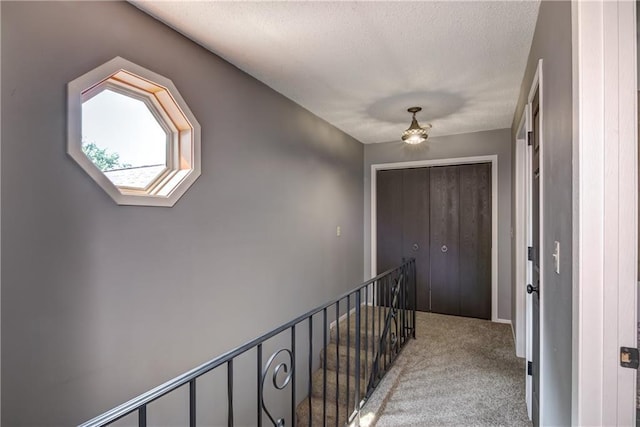 45 Stump Lake Rd Unit 6, Chippewa Falls, WI 54729 - corridor with light colored carpet, an upstairs landing, and a textured ceiling
