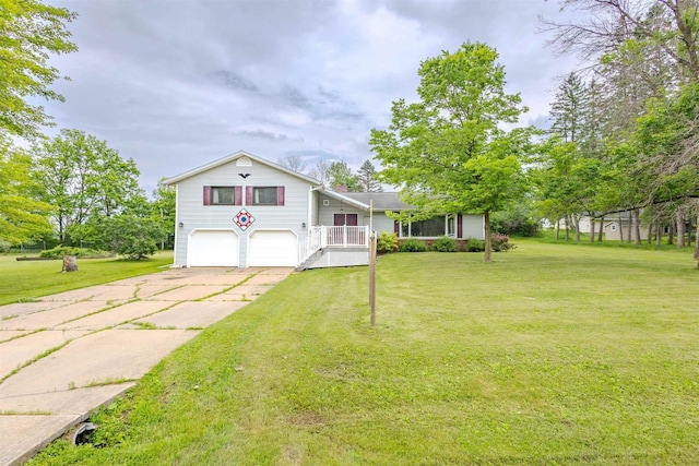 7040 Blonien Ave, Rudolph, WI 54475 - view of front facade featuring an attached garage, concrete driveway, and a front yard