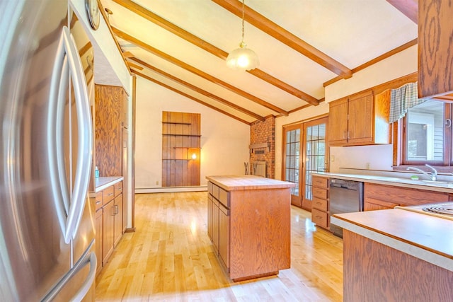 7040 Blonien Ave, Rudolph, WI 54475 - kitchen with stainless steel appliances, beam ceiling, light countertops, a center island, and light wood-style floors
