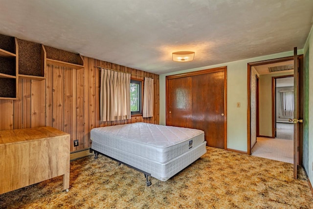 7040 Blonien Ave, Rudolph, WI 54475 - carpeted bedroom featuring baseboard heating and wood walls