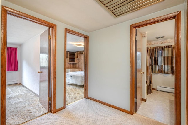 7040 Blonien Ave, Rudolph, WI 54475 - corridor featuring a baseboard heating unit, carpet floors, and baseboard heating