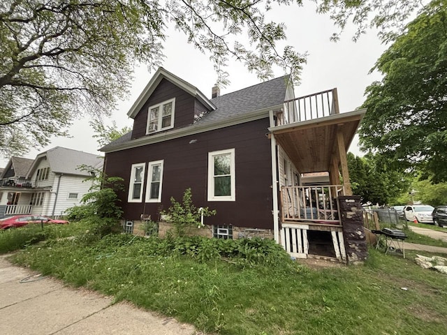 2432 W Concordia Ave, Milwaukee, WI 53206 - view of side of home with a chimney and roof with shingles