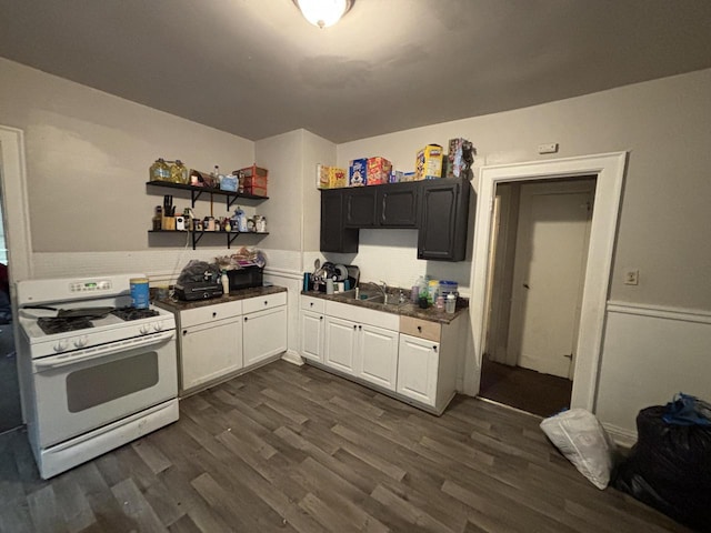 3350 N 25th St Unit 3350A, Milwaukee, WI 53206 - kitchen featuring white gas stove, dark countertops, dark wood finished floors, open shelves, and white cabinetry