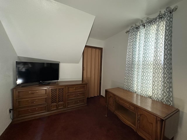 2467 N Bartlett Ave Unit 2467A, Milwaukee, WI 53211 - interior space with dark colored carpet and lofted ceiling