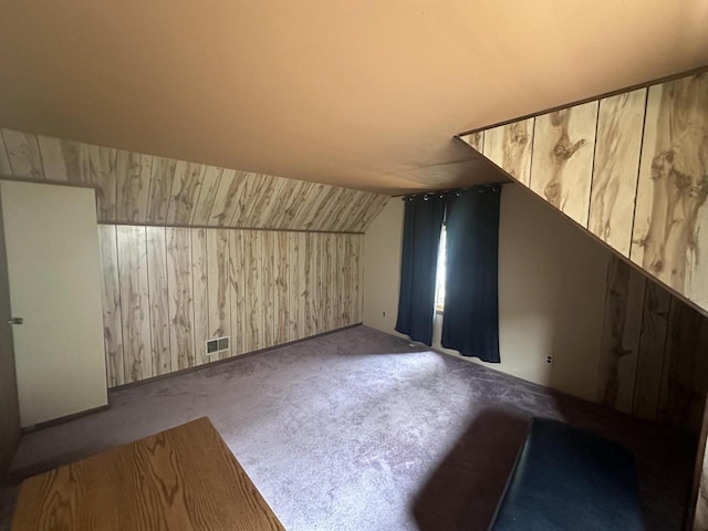 2467 N Bartlett Ave Unit 2467A, Milwaukee, WI 53211 - additional living space featuring wooden walls, carpet floors, and lofted ceiling
