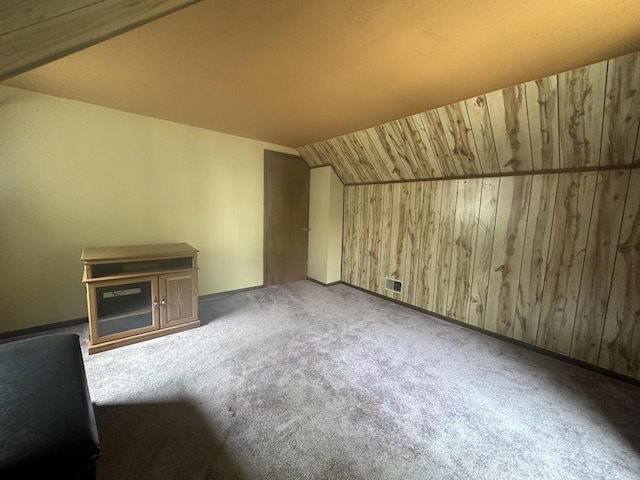 2467 N Bartlett Ave Unit 2467A, Milwaukee, WI 53211 - additional living space featuring carpet, vaulted ceiling, and wood walls