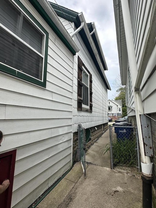 2467 N Bartlett Ave Unit 2467A, Milwaukee, WI 53211 - view of side of home featuring a gate