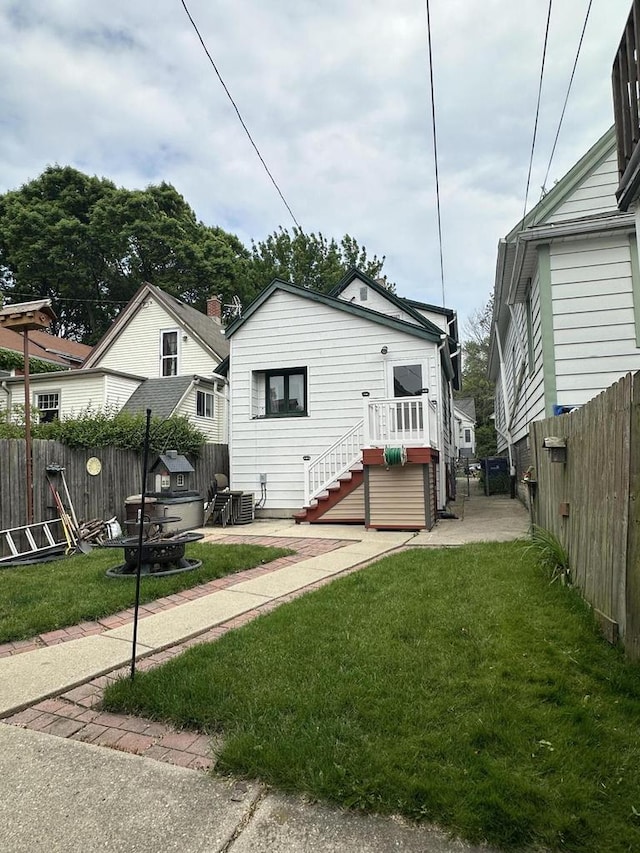 2467 N Bartlett Ave Unit 2467A, Milwaukee, WI 53211 - bungalow-style house featuring a fenced backyard, stairway, and a deck