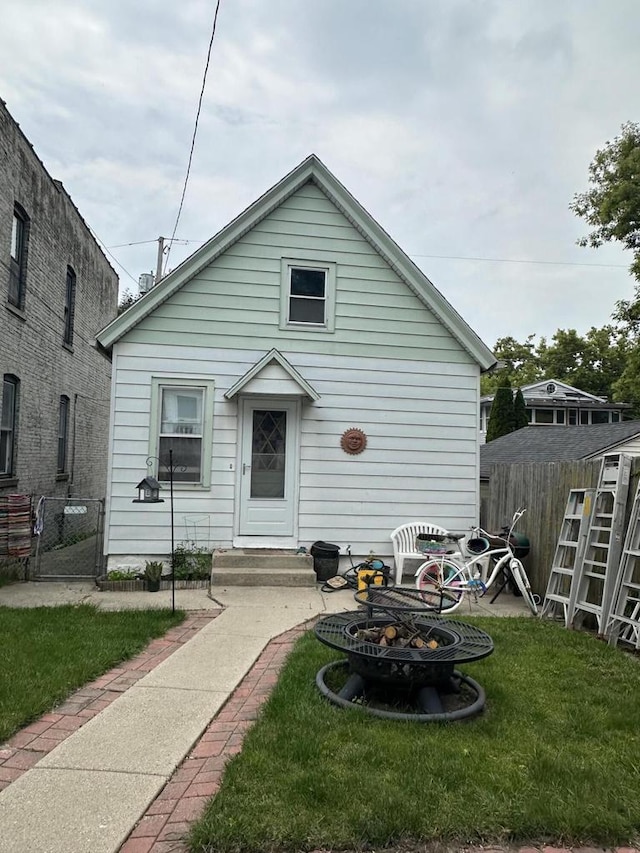 2467 N Bartlett Ave Unit 2467A, Milwaukee, WI 53211 - back of house featuring a fire pit