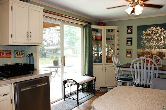 68165 Front St, Iron River, WI 54847 - dining area featuring ceiling fan, wood finished floors, and crown molding