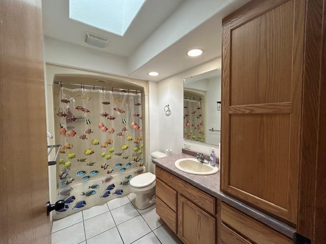 5201 Lombardy Dr, Wausau, WI 54401 - full bathroom featuring tile patterned flooring, vanity, a skylight, and recessed lighting