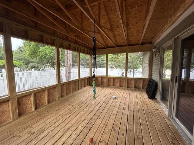 5201 Lombardy Dr, Wausau, WI 54401 - unfurnished sunroom with lofted ceiling, hardwood / wood-style floors, and a deck