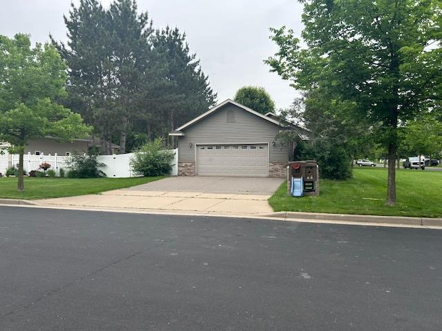 5201 Lombardy Dr, Wausau, WI 54401 - view of front of house with driveway and an attached garage