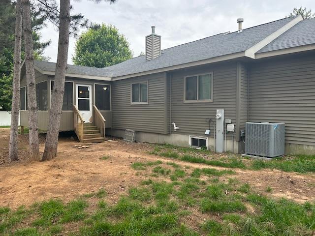 5201 Lombardy Dr, Wausau, WI 54401 - back of property featuring a chimney and entry steps
