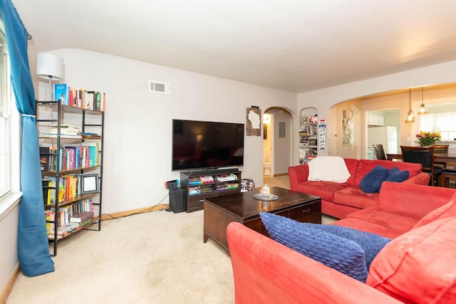 6533 W Center St, Wauwatosa, WI 53210 - living area featuring arched walkways and carpet