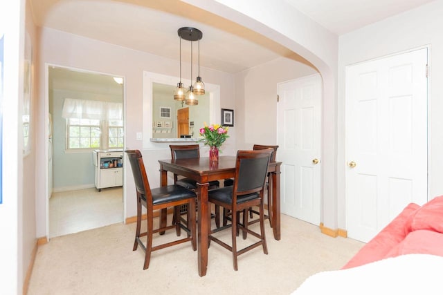 6533 W Center St, Wauwatosa, WI 53210 - dining space featuring arched walkways and light carpet