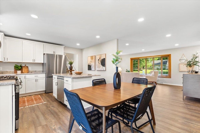 N113W20588 Edgewood Dr, Germantown, WI 53022 - dining area with light wood-style floors and recessed lighting