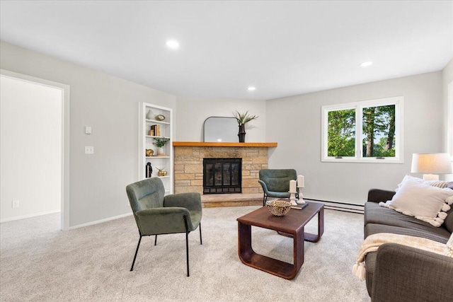 N113W20588 Edgewood Dr, Germantown, WI 53022 - living room featuring a stone fireplace, a baseboard heating unit, recessed lighting, and carpet flooring