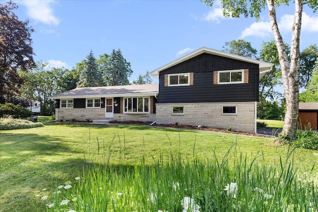 N113W20588 Edgewood Dr, Germantown, WI 53022 - view of front facade featuring stone siding and a front yard