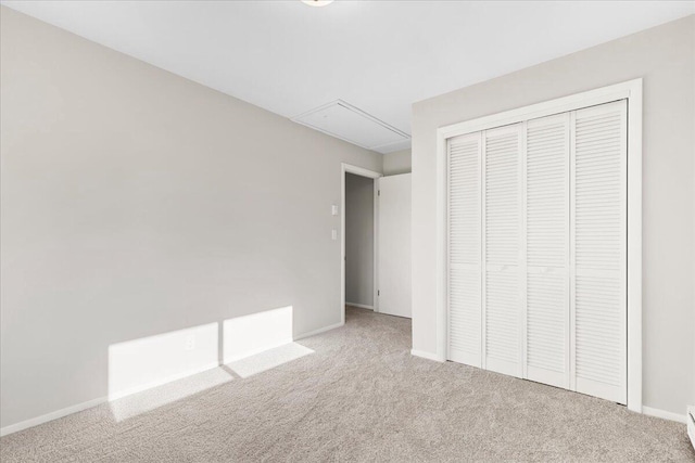 N113W20588 Edgewood Dr, Germantown, WI 53022 - unfurnished bedroom featuring attic access, carpet floors, and a closet