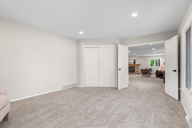 N113W20588 Edgewood Dr, Germantown, WI 53022 - unfurnished living room with recessed lighting, a fireplace, and carpet