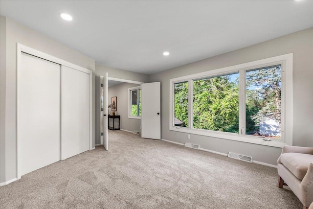 N113W20588 Edgewood Dr, Germantown, WI 53022 - unfurnished bedroom with light carpet, recessed lighting, and a closet