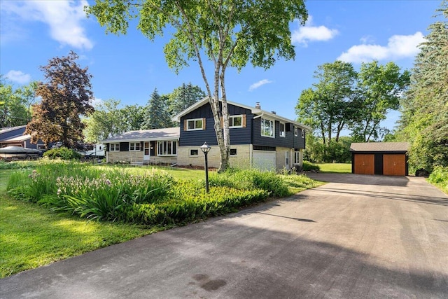 N113W20588 Edgewood Dr, Germantown, WI 53022 - tri-level home featuring a storage unit and a front yard