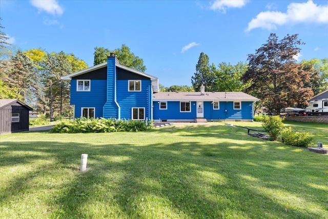 N113W20588 Edgewood Dr, Germantown, WI 53022 - back of property with a chimney and a yard