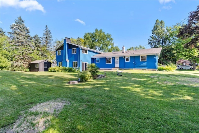 N113W20588 Edgewood Dr, Germantown, WI 53022 - view of front of home with a chimney, a shed, and a front lawn