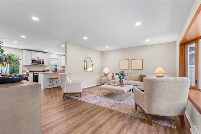 N113W20588 Edgewood Dr, Germantown, WI 53022 - living area with light wood-style floors and recessed lighting