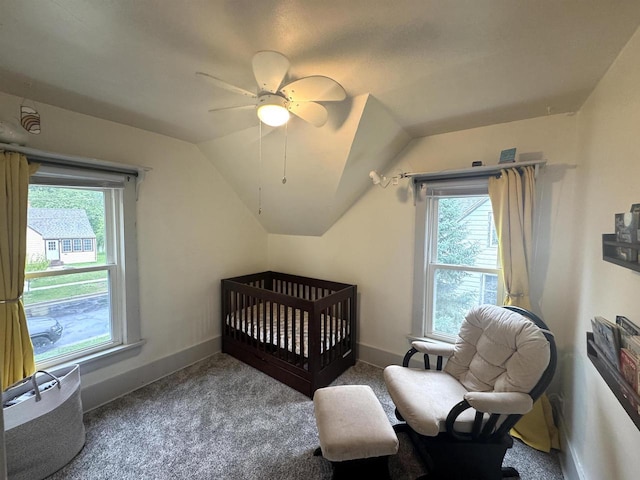 514 Robert St, Fort Atkinson, WI 53538 - carpeted bedroom with vaulted ceiling, multiple windows, and ceiling fan