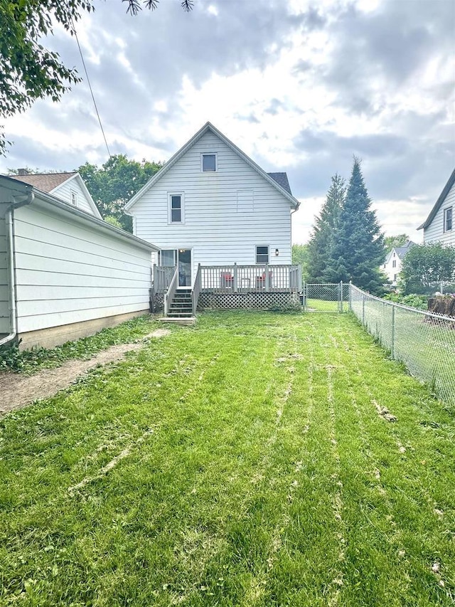 514 Robert St, Fort Atkinson, WI 53538 - rear view of property with a fenced backyard and a wooden deck